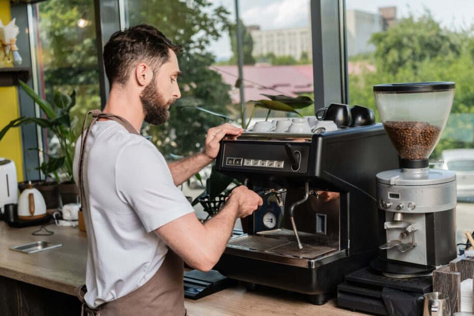 bearded barista in coffee bar